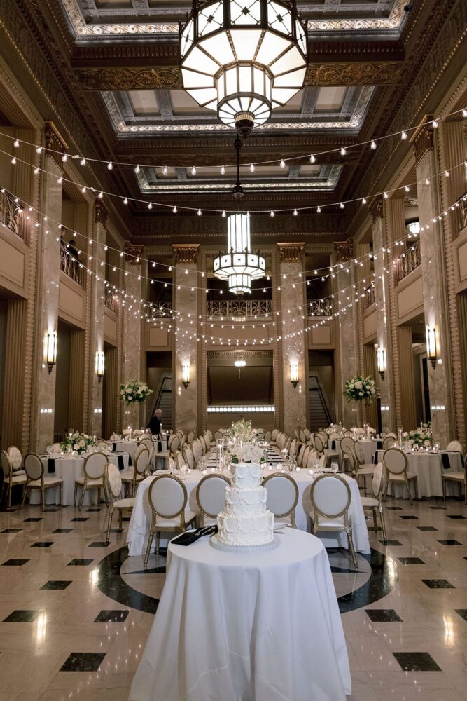 Stifel Theatre Grand Lobby wedding reception with white flowers, candlelight, and a long head table
