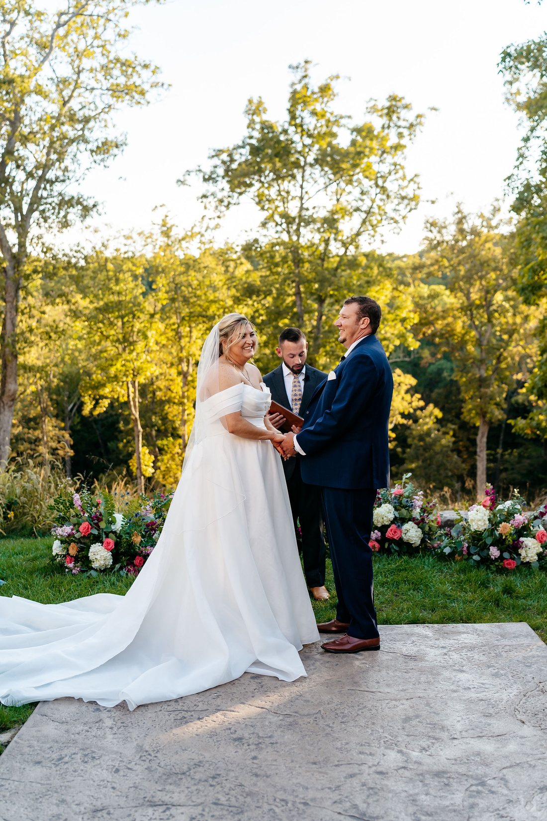Outdoor wedding ceremony at Silver Oaks Chateau with a ground flower arch