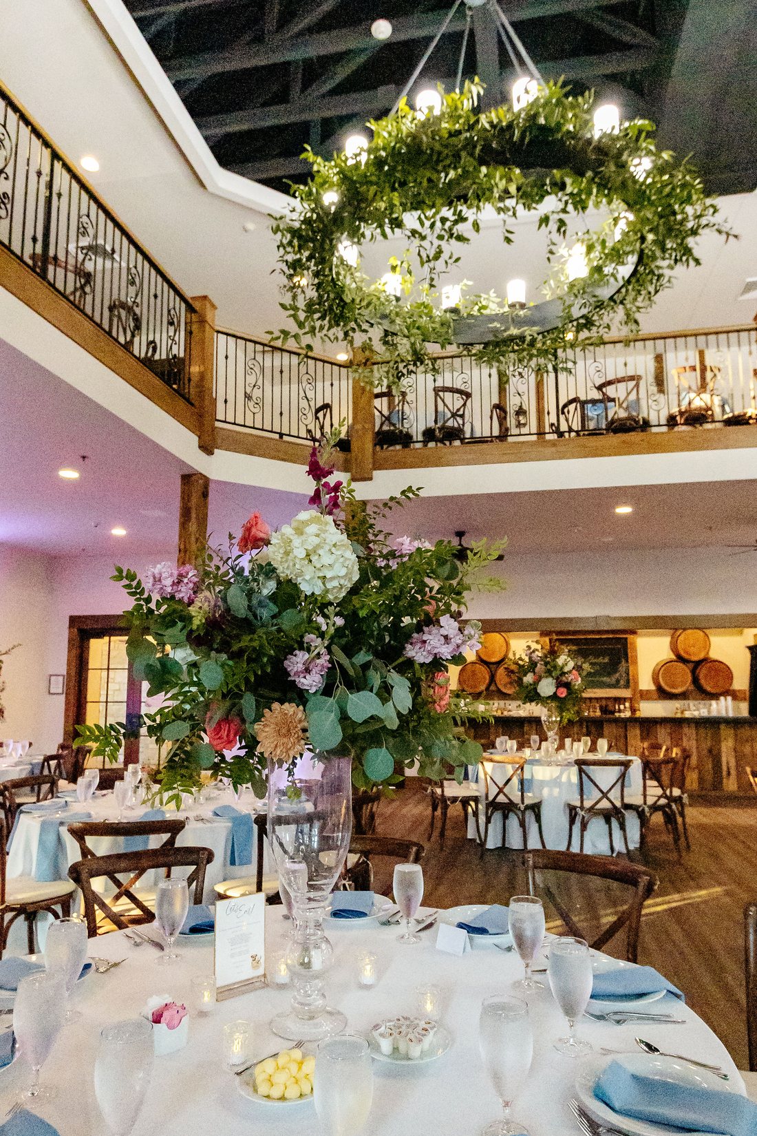 Tall floral centerpiece on a wedding reception table at Silver Oaks Chateau