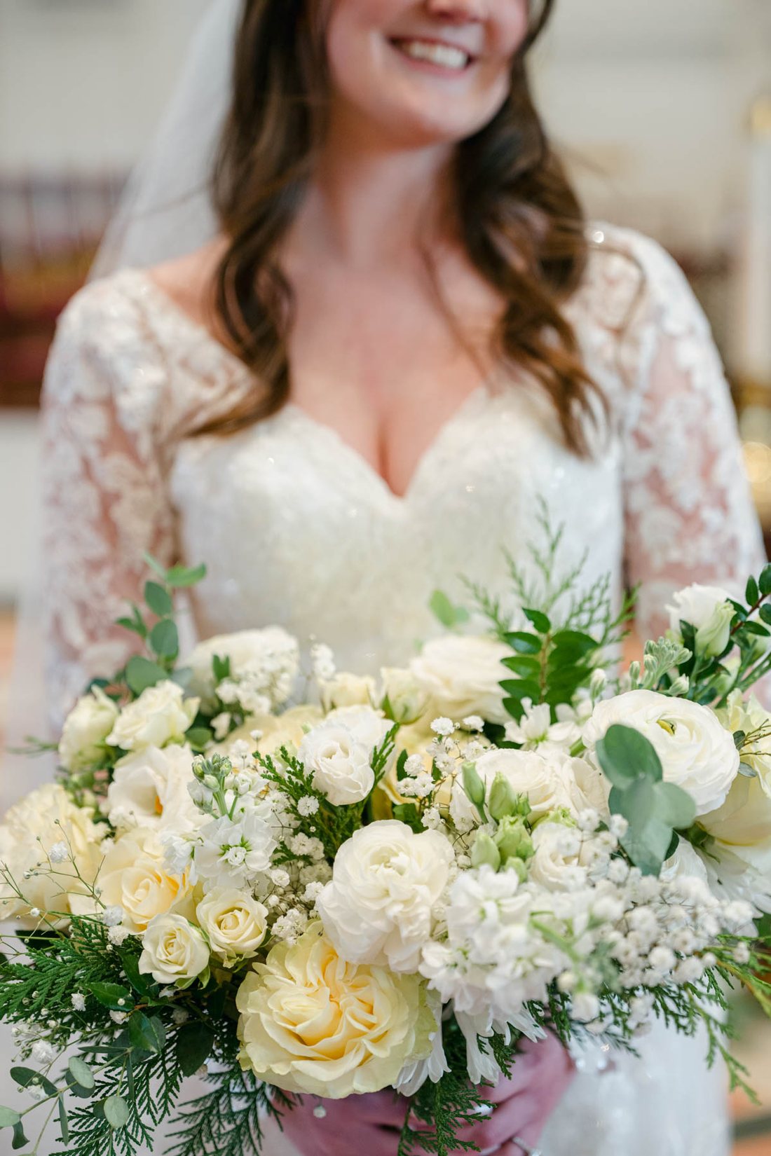 White bridal bouquet with winter wedding flowers