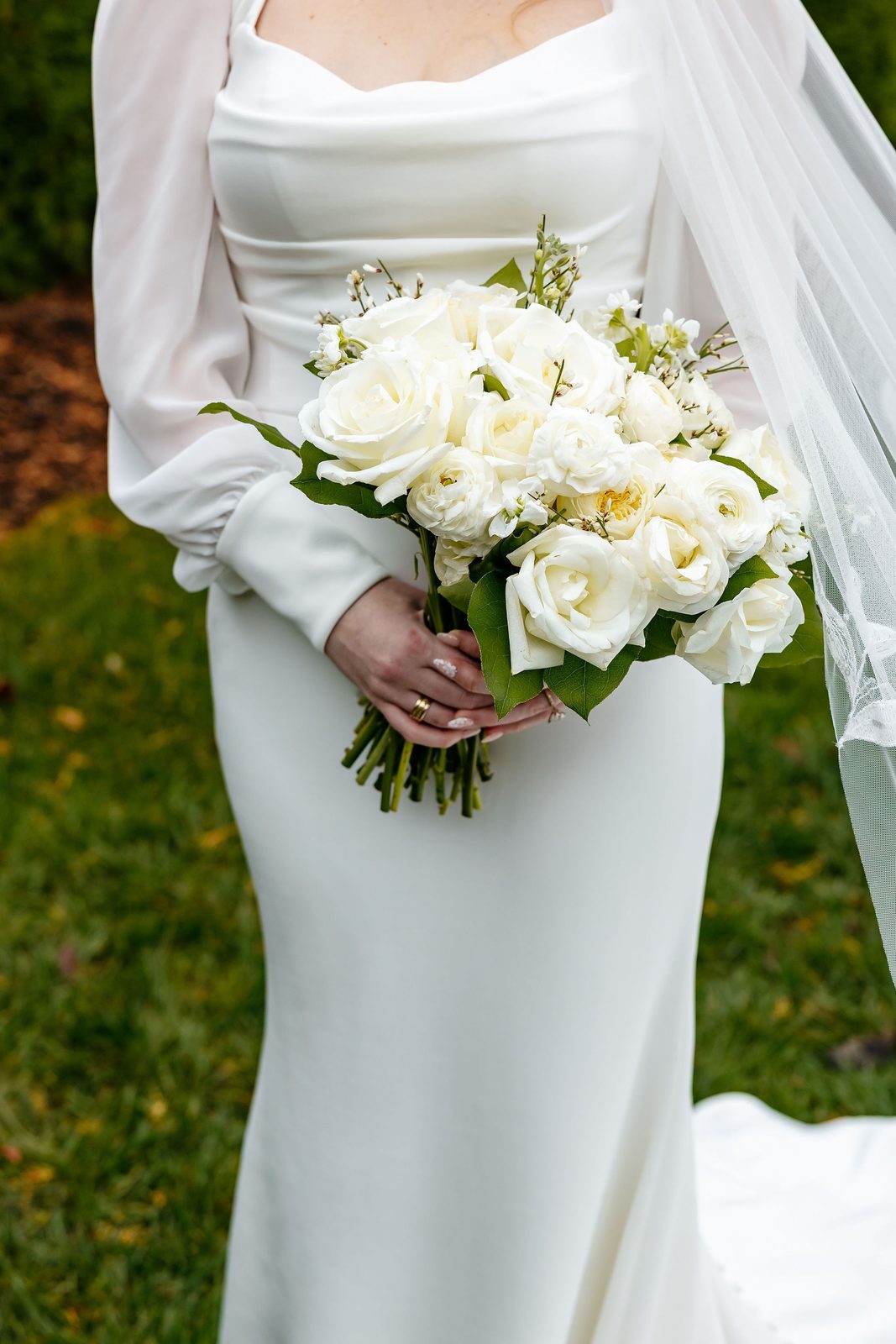 Close-up of an ivory garden rose bridal bouquet with ranunculus